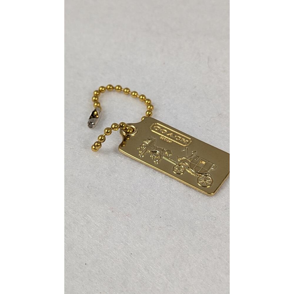 Coach metal bag tag goldtone Stagecoach 1 34" x 7/8"Ball chain included EUC - Picture 3 of 6